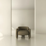 Modern minimalist armchair in neutral room with soft natural lighting